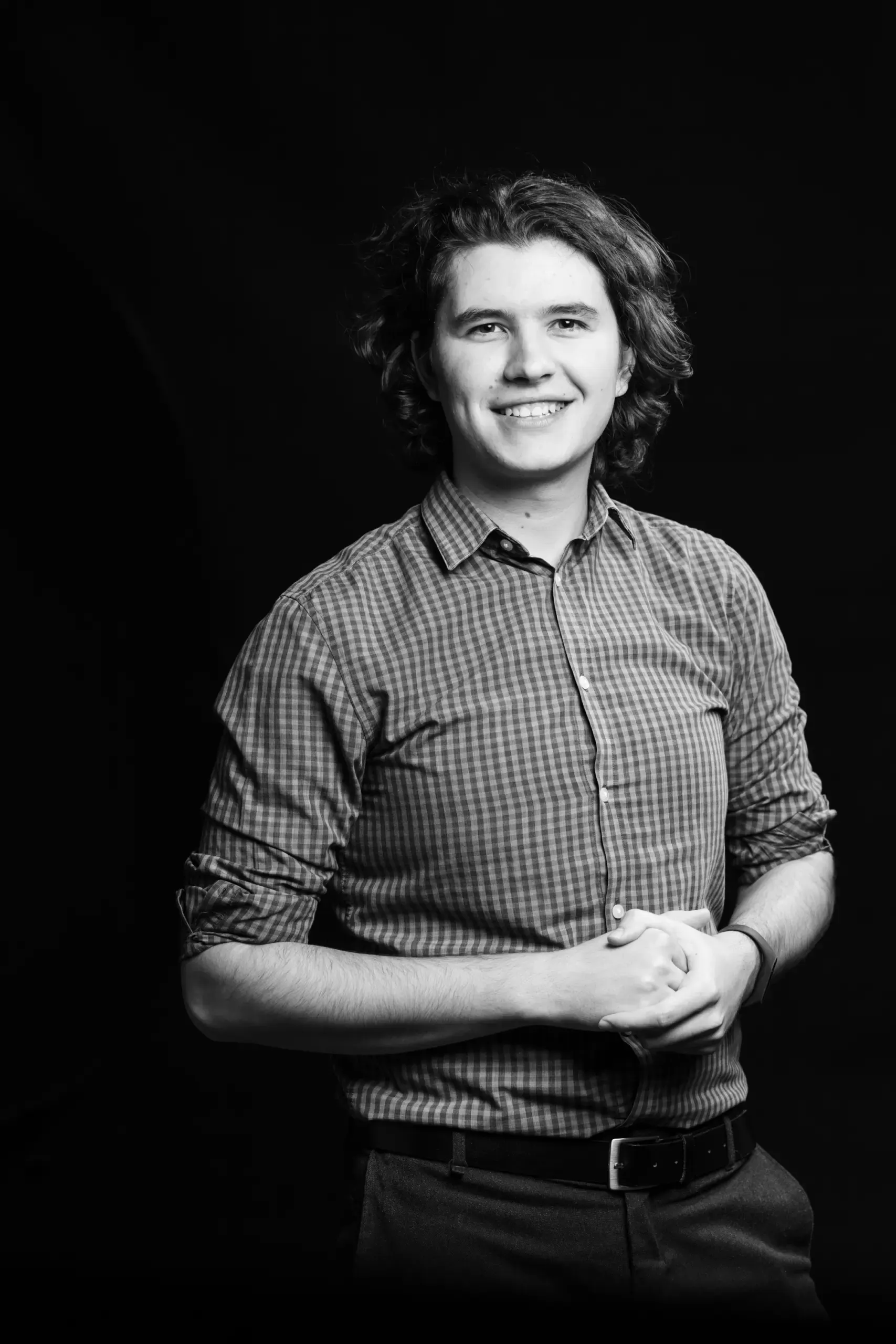 Portrait eines lächelnden Mannes im karierten Hemd, Verve Ventures
